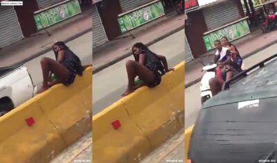 Mad African Woman Fucking Herself With A Bottle On A Road Divider In Public Viral